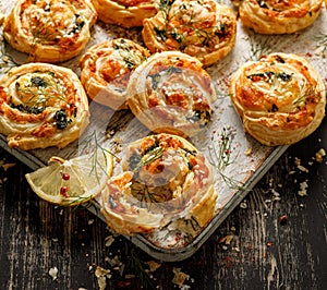 Puff Pastry Pinwheels stuffed with salmon, cheese and spinach in a bowl