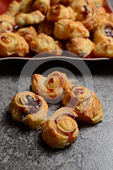 Puff pastry rolls with fruity marmalade