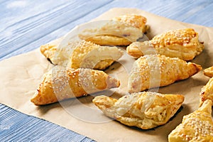 Puff pastry triangles filled with feta cheese and leek. photo