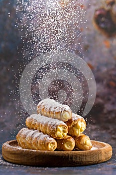 Puff pastry tubes filled with custard