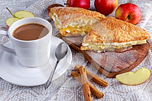 Puff pastry Turnovers apple cake dessert with whipped cream and hot coffee.