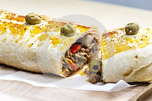 puff roly-poly filled with minced meat and green olives