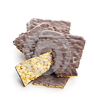 Puffed corn crackers chocolate covered isolated on white background