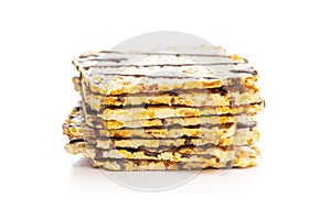 Puffed corn crackers chocolate covered isolated on white background