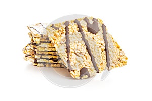 Puffed corn crackers chocolate covered isolated on white background