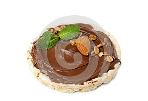 Puffed rice cake with chocolate spread, nuts and mint isolated