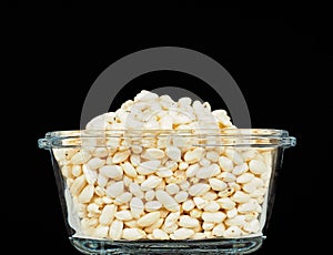 Puffed rice in translucent square glass bowl