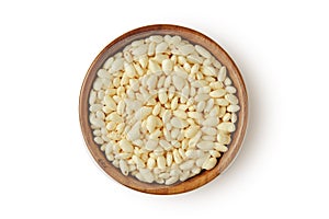 Puffed rice in wooden bowl on white background