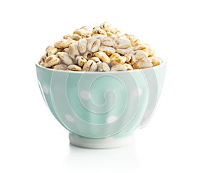 Puffed wheat covered with honey in bowl