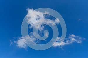 Puffy clouds on blue sky background