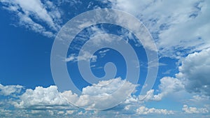 Puffy fluffy white clouds. Forming cloud moving with blue sunny, summer skies. Time lapse.