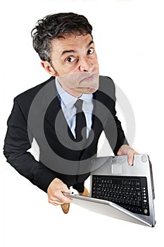 Pugnacious businessman holding a laptop