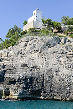 Pugno chiuso lighthouse on the coast of Gargano National park photo