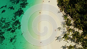 Puka Shell Beach. Seascape with island of Boracay, Philippines, top view. People relax on the beautiful coast.