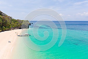 Puka Shell Beach. Wide tropical beach with white sand. Beautiful white beach and azure water on Boracay island