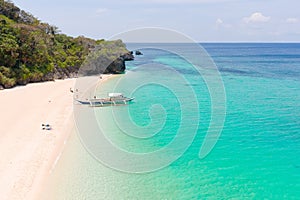 Puka Shell Beach. Wide tropical beach with white sand. Beautiful white beach and azure water on Boracay island