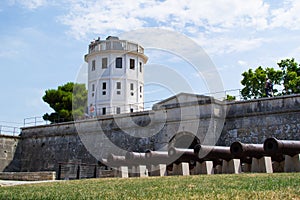 Pula Castle also called Kastel or Fortress Kastel with its cannons at the foreground, in Pula, Croatia