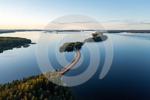 Pulkkilanharju ridge road and calm PÃÂ¤ijÃÂ¤nne lake in summer in Finland photo