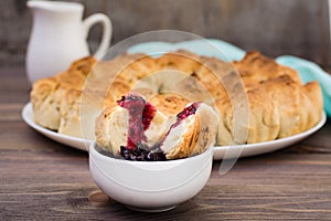 Pull apart monkey bread with black currant jam in a plate