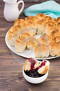 Pull apart monkey bread with black currant jam in a plate