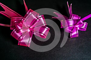 Pull Flower Ribbon for Gift Wrap Lighting Effect On Black Background Wallpaper Image Beautiful Abstract Scenario Image