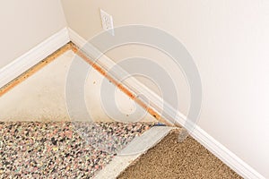 Pulled Back Carpet and Padding In Room photo