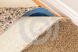 Pulled Back Carpet and Padding In Room photo