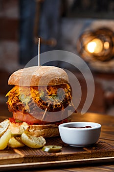 Pulled pork BBQ burger with tomatoes and jalapeno selected focus