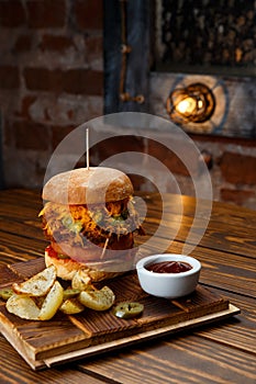 Pulled pork BBQ burger with tomatoes and jalapeno selected focus