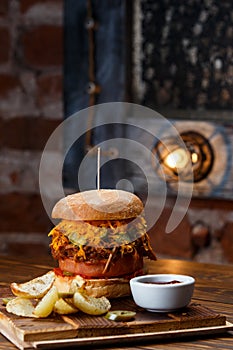 Pulled pork BBQ burger with tomatoes and jalapeno selected focus