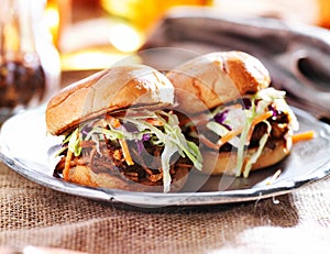 Pulled pork sandwiches with bbq sauce and slaw