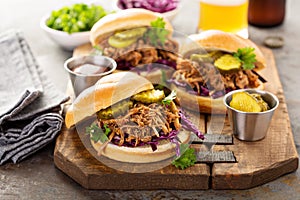 Pulled pork sandwiches with cabbage and pickles
