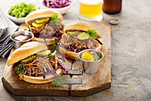 Pulled pork sandwiches with cabbage and pickles