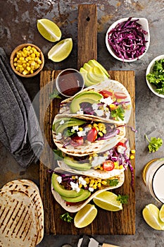 Pulled pork tacos with red cabbage and avocados