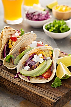 Pulled pork tacos with red cabbage and avocados