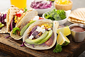 Pulled pork tacos with red cabbage and avocados