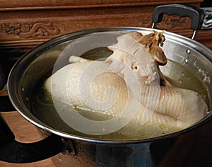 Pullet broth in stockpot