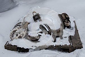 Pulley blocks covered by snow photo