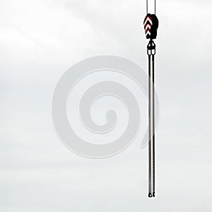 Pulley hanging from crane