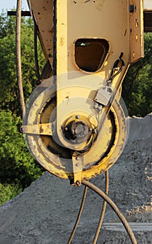 pulley from heavy machinery crane in the construction of road junction in Moscow.