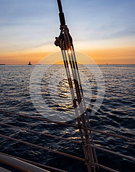 Pulley silhouette on a sailboat at sunset
