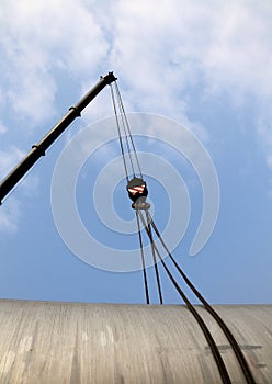 Pulley with steel cables to lift loads during loading