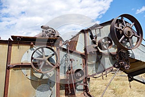 Pulley system on old abandoned farm harvester.