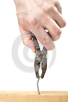 Pulling a bent nail with pliers