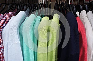 Pullovers on hangers. photo