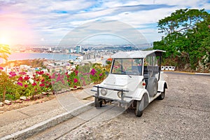 Pulmonia taxi with panoramic view of the Mazatlan Old City in the background, Mexico