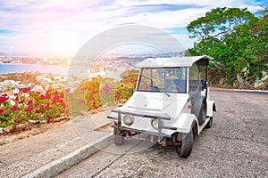 Pulmonia taxi with panoramic view of the Mazatlan Old City in the background, Mexico