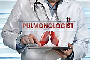 Pulmonologist working with tablet in hands in the lab with text