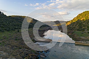 Pulo do Lobo waterfall drone aerial view with river guadiana and beautiful green valley landscape at sunset in Mertola Alentejo,