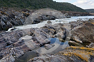 Pulo do Lobo waterfall with river guadiana and rock details in Mertola Alentejo, Portugal